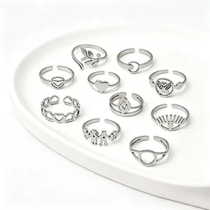 Collection of silver stainless steel rings with unique heart, leaf and butterfly designs