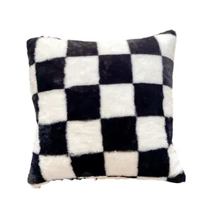 Soft black and white checkerboard plush cushion cover made of luxurious faux rabbit fur