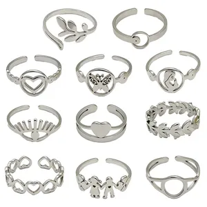 Set of 11 silver stainless steel rings with various retro heart and leaf designs