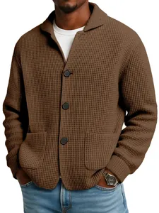 Detail view of brown waffle knit cardigan with textured fabric and buttons for men