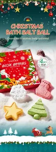 Detailed view of Christmas bath salt balls in festive shapes with red gift packaging