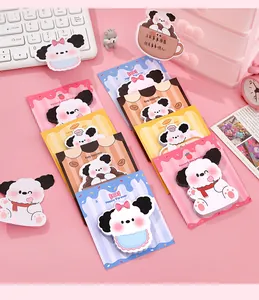Close-up detail of cute cartoon dog-shaped sticky notes in various colorful patterns