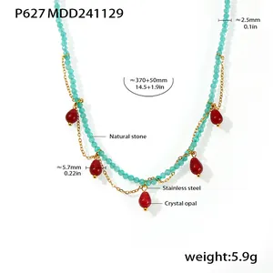 Detailed view of handmade beaded necklace featuring red crystal opal teardrop charms