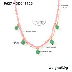 Close-up detail view of pink natural stone beaded necklace with green crystal opal teardrops