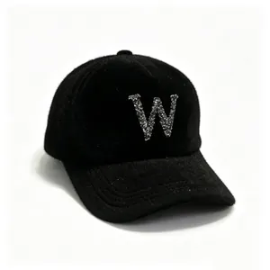 Detailed view of women's black mink hair baseball cap with sparkly rhinestone letter W