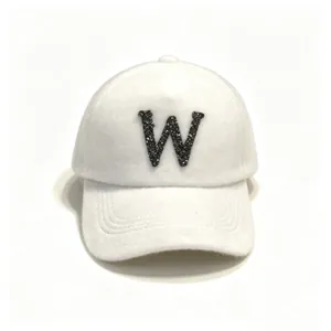 White fuzzy mink hair baseball cap with a sparkling rhinestone letter W detail.