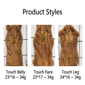 Close-up view of three cartoon capybara coral fleece hand towels in various poses