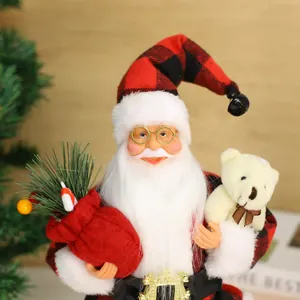 Festive 9cm standing Santa Claus figurine in red buffalo plaid holding a white teddy bear