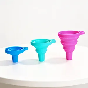 Three colorful silicone collapsible funnels in various stages of expansion on a white surface