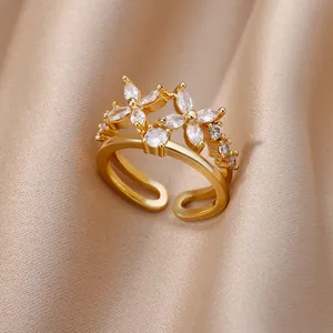 Detailed close-up of 18K gold plated open ring with double sparkling zircon flower design