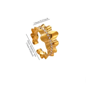 Detailed view of a wavy gold plated ring with measurements for inner diameter and width