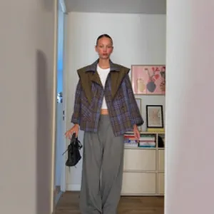 Full view of loose plaid cardigan and wide-leg trousers lazy style two-piece set