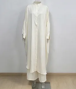 Full front view of a striped stand collar long shirt and wide-leg pants set on a mannequin