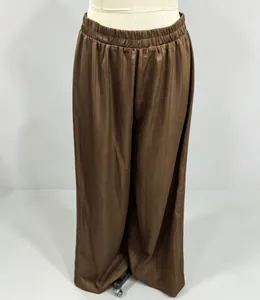 Close-up of brown striped wide-leg pants featuring a comfortable elastic waistband