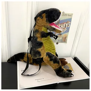 Dettaglio laterale di uno zaino dinosauro T-Rex in peluche con spallacci neri regolabili