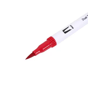 Macro detail of the red soft fiber brush tip of a dual-tip watercolor pen marker