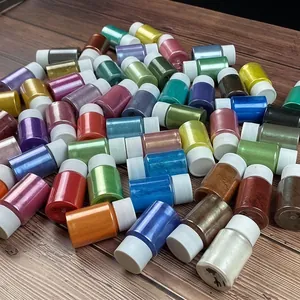Assortment of shimmering mica pearl pigment powder jars for DIY resin and slime crafts