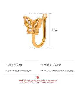 Detail view of a gold U-shaped fake nose ring with a sparkling butterfly design.