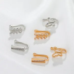 Close-up detail of stylish crystal butterfly and leaf non-piercing U-shaped nose cuffs
