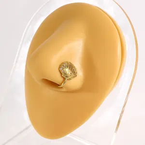 Gold shell non-pierced nose clip with cubic zirconia, detailed view of the clip design.