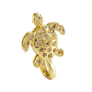 Close-up view of a luxury gold turtle-shaped non-pierced nose clip inlaid with zircon stones