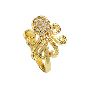 Detail view of a gold octopus-shaped non-piercing nose cuff with sparkling zircon inlay.