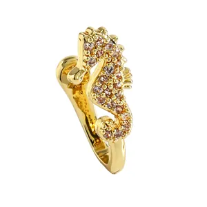 Detail view of gold-plated copper seahorse nose cuff with sparkling zircon inlay