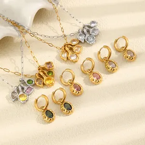 Detailed view of titanium steel 18K gold jewelry with colored zircon and hammered texture
