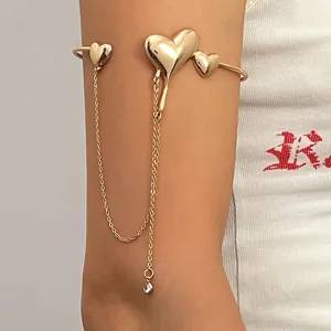 Gold lava heart arm cuff bracelet with elegant long chain tassels for stylish women