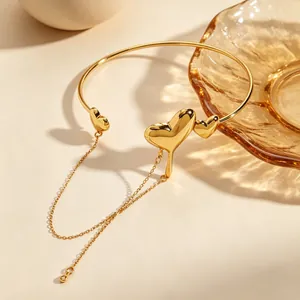 Detailed view of a gold lava heart bracelet with elegant chain tassel detail