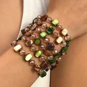 Close-up of retro Maillard style beaded bracelet with green and brown shell beads