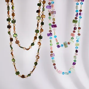 Macro view of vintage Maillard style layered necklaces with colorful shell and glass beads