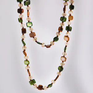 Detail of retro Maillard beaded necklace with earthy brown and green tones