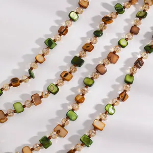 Detail of retro Maillard beaded necklace with green and brown shell beads
