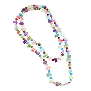 Detailed view of long vintage necklace with colorful flat shell beads and faceted crystals.