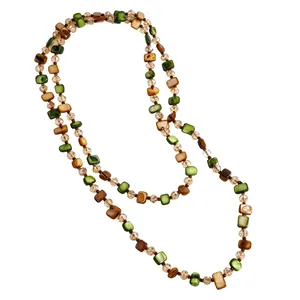 Close-up of vintage Maillard style beaded layered necklace with green and brown beads