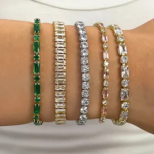 Elegant close-up of five colorful crystal tennis bracelets worn on a wrist for styling.