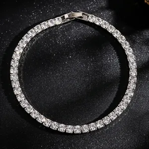 Close-up macro view of a silver tennis necklace with square sparkling zircon stones