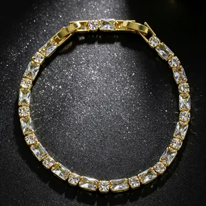 Detailed view of elegant gold-tone tennis bracelet with shimmering clear zircon stones