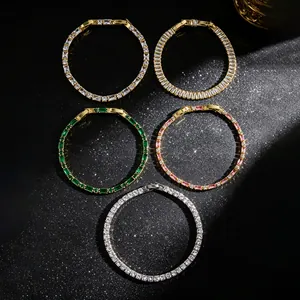 Macro view of five elegant sparkling tennis bracelets with green pink and clear stones