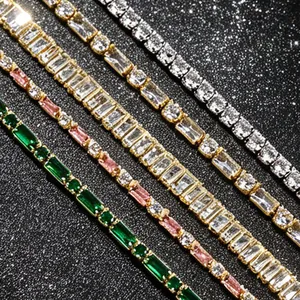 Close-up of elegant multi-color zircon tennis bracelets featuring emerald and pink stones