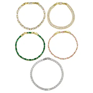 Detail view of five assorted diamond-set tennis bracelets in gold and silver finishes