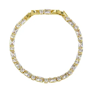 Detailed close-up view of elegant gold-plated bracelet featuring square and round crystals