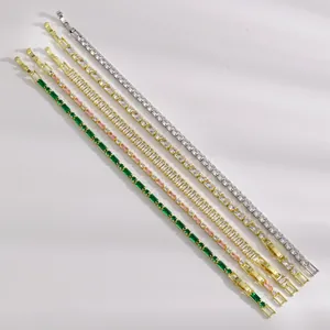 Detail view of five tennis bracelets with vibrant colored stones in gold and silver settings.