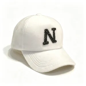 White faux mink fur baseball cap with sparkling black letter N detail
