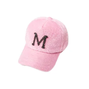 Pink faux mink fur baseball cap for women with sparkly black rhinestone letter M