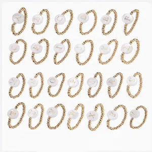 Full set of 26 rose gold beaded stretch rings featuring white shell letter charms