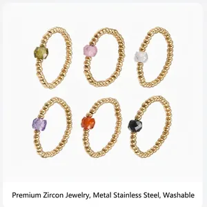 Detailed view of elastic stainless steel bead rings with multi-color zircon stones.