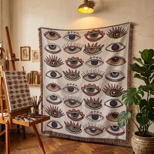 Couverture tissée bohème artistique aux motifs d'yeux colorés en décoration murale