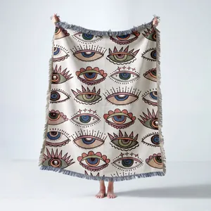 Couverture tissée bohème avec motif œil et franges pour pique-nique et décoration canapé